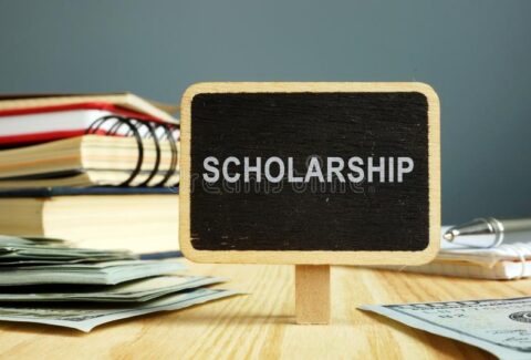 scholarship-concept-notebooks-money-education-149496706