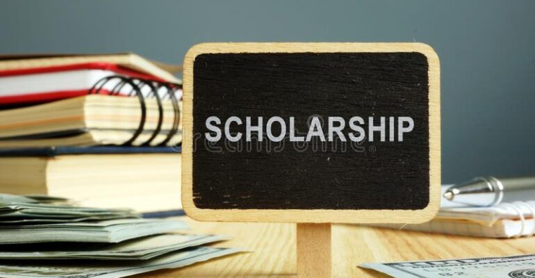scholarship-concept-notebooks-money-education-149496706